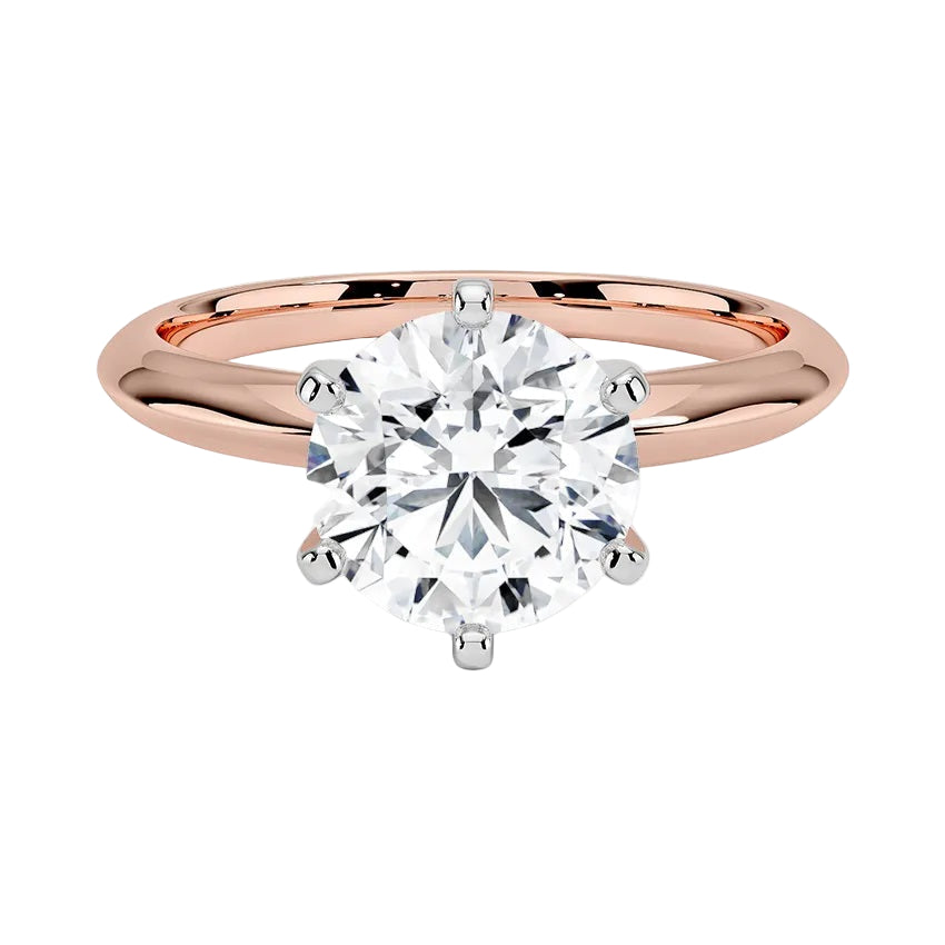 Close-up of a D-color VVS1 round moissanite in rose gold prongs to prevent yellow metal reflection.